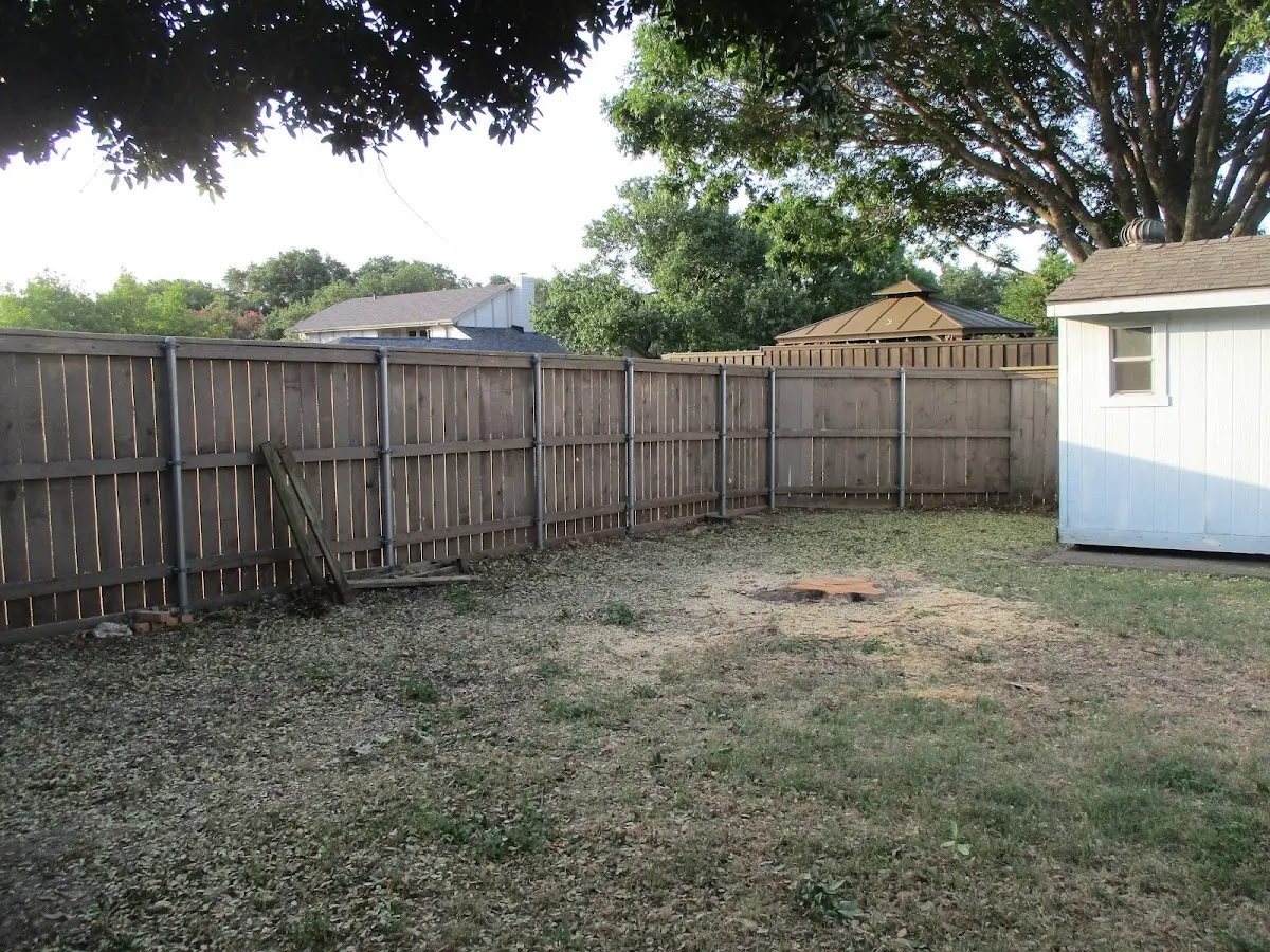 Cleared yard after professional tree removal in Shubuta